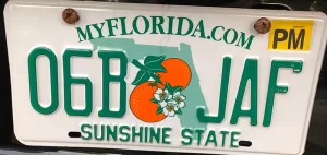 A Florida license plate with PM sticker